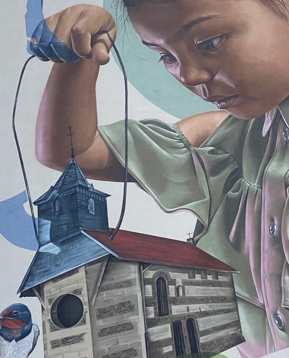 Detail van muurschildering in Geleen – meisje op grote hoogte