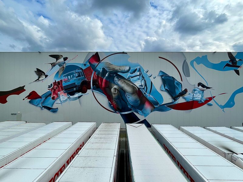 gomad street art mural muurschildering oss bedrijfspand gevel loods Overzicht van muurschildering op koelcel in Oss – graffiti artiest voor grote projecten